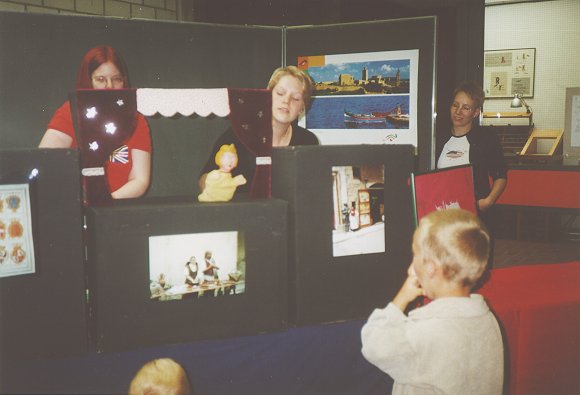 our youngest market visitors fascinated by the puppet show